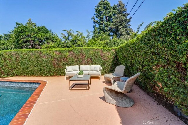 12312 Eveningside Dr, Santa Ana, CA 92705 - fenced backyard with an outdoor hangout area and a patio