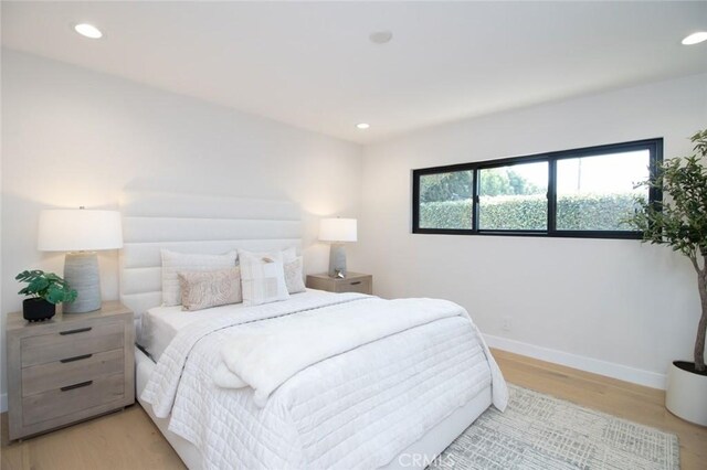 12312 Eveningside Dr, Santa Ana, CA 92705 - bedroom with light wood finished floors, recessed lighting, and baseboards