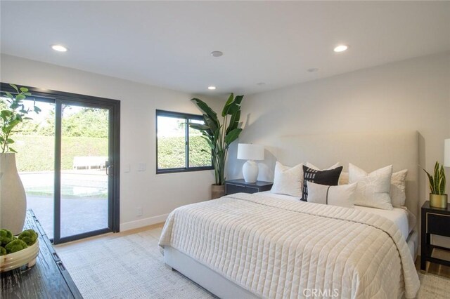 12312 Eveningside Dr, Santa Ana, CA 92705 - bedroom with access to exterior, recessed lighting, baseboards, and light wood-style flooring