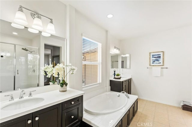 2974 E Walking Beam Pl, Brea, CA 92821 - full bath featuring a stall shower, tile patterned floors, a garden tub, two vanities, and baseboards