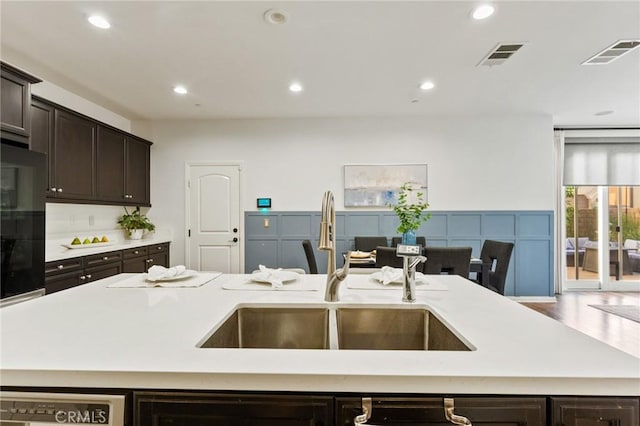 2974 E Walking Beam Pl, Brea, CA 92821 - kitchen with a sink, light countertops, dark brown cabinetry, recessed lighting, and open floor plan