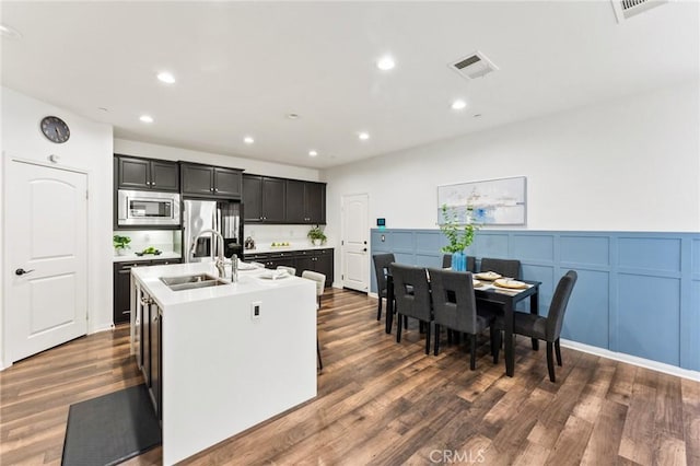 2974 E Walking Beam Pl, Brea, CA 92821 - kitchen featuring a sink, appliances with stainless steel finishes, an island with sink, recessed lighting, and dark wood-style floors