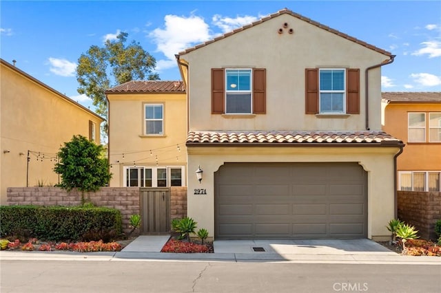 2974 E Walking Beam Pl, Brea, CA 92821 - mediterranean / spanish-style home with a tiled roof, an attached garage, stucco siding, and driveway