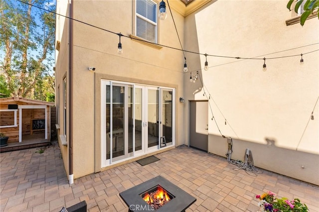 2974 E Walking Beam Pl, Brea, CA 92821 - view of patio / terrace featuring a fire pit and french doors