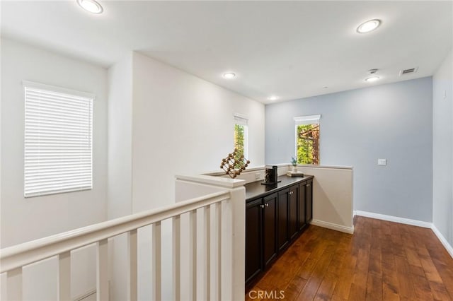 2974 E Walking Beam Pl, Brea, CA 92821 - corridor featuring dark wood-style floors, recessed lighting, an upstairs landing, and baseboards