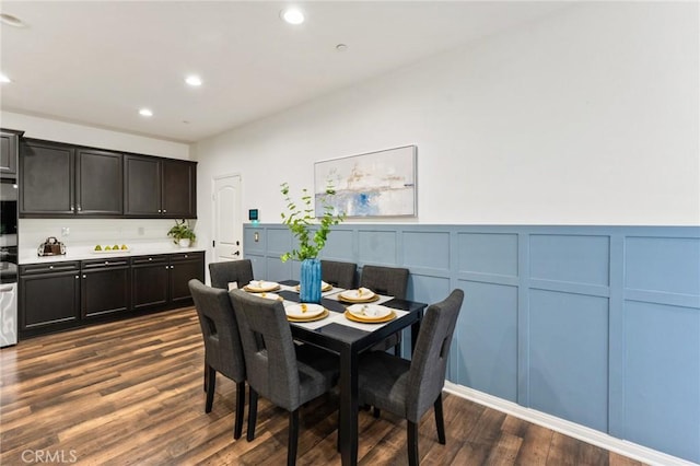 2974 E Walking Beam Pl, Brea, CA 92821 - dining space featuring a decorative wall, dark wood finished floors, recessed lighting, and a wainscoted wall