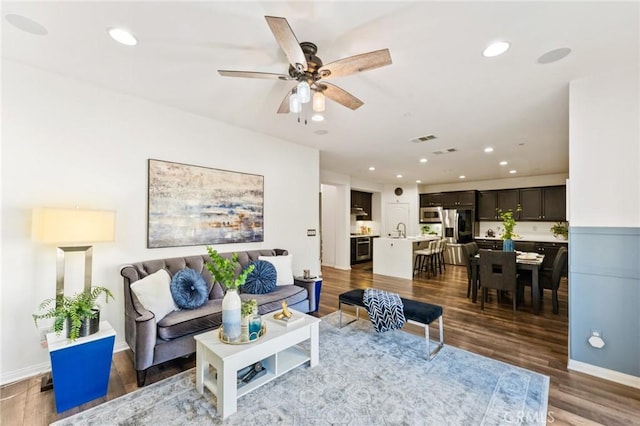 2974 E Walking Beam Pl, Brea, CA 92821 - living area with wood finished floors, a ceiling fan, recessed lighting, and baseboards