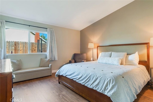 2637 Alder Creek Dr, Ontario, CA 91761 - bedroom featuring wood finished floors and vaulted ceiling