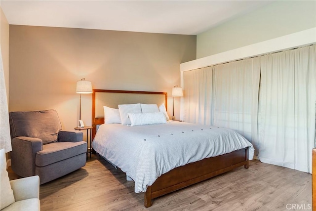 2637 Alder Creek Dr, Ontario, CA 91761 - bedroom featuring wood finished floors and vaulted ceiling