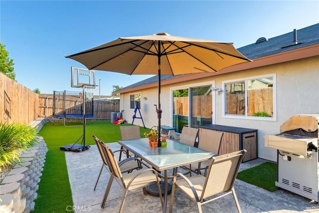 2637 Alder Creek Dr, Ontario, CA 91761 - view of patio / terrace with a trampoline, outdoor dining area, and area for grilling