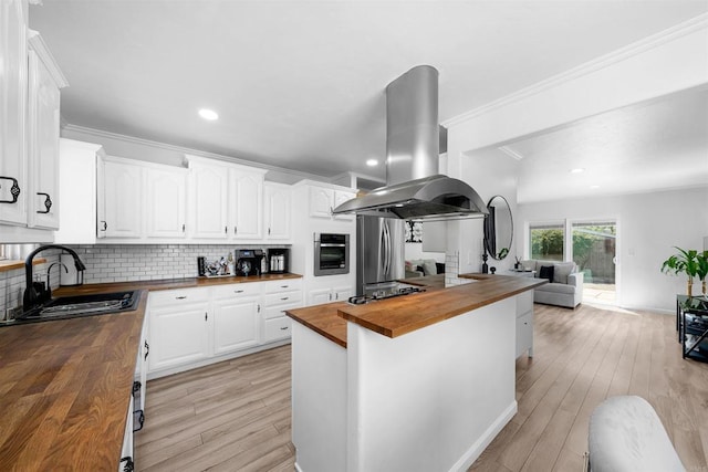 3117 Cherimoya St, Jamul, CA 91935 - kitchen featuring wood counters, island range hood, a sink, stainless steel appliances, and open floor plan
