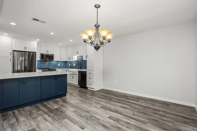 6804 Urubu St, Carlsbad, CA 92009 - kitchen with appliances with stainless steel finishes, light countertops, white cabinetry, baseboards, and recessed lighting
