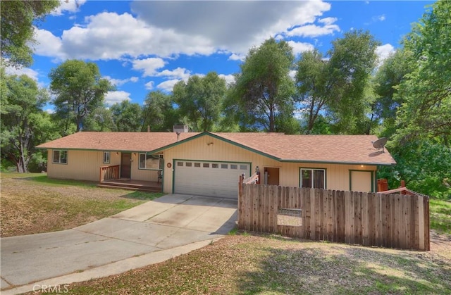 51864 Mountain Quail Pl, Oakhurst, CA 93644 - ranch-style home with an attached garage and concrete driveway