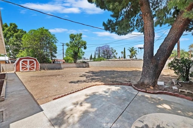 fenced yard with a patio area