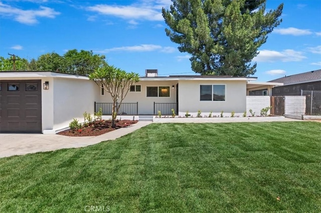 ranch-style house with stucco siding, a garage, and driveway