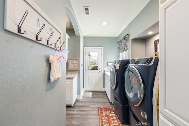 38855 Bella Vista Rd, Temecula, CA 92592 - laundry area featuring washer and dryer, wood finished floors, recessed lighting, and arched walkways