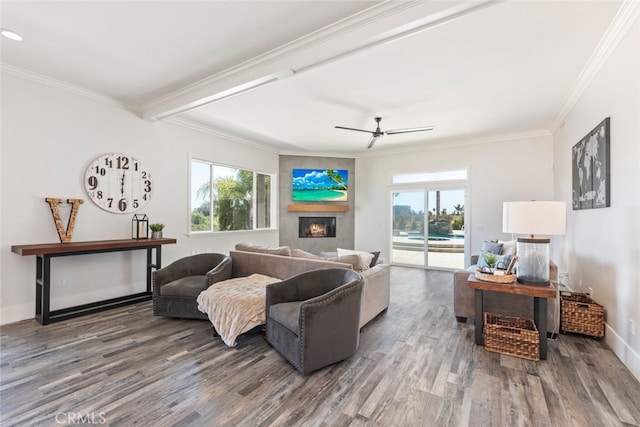 38855 Bella Vista Rd, Temecula, CA 92592 - living area featuring wood finished floors, a lit fireplace, plenty of natural light, and crown molding
