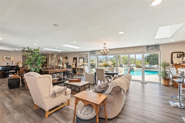 38855 Bella Vista Rd, Temecula, CA 92592 - living area featuring a skylight, wood finished floors, plenty of natural light, a chandelier, and recessed lighting