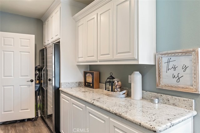 38855 Bella Vista Rd, Temecula, CA 92592 - kitchen with white cabinets, dark wood finished floors, stainless steel fridge, and light stone counters