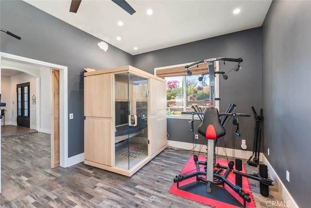38855 Bella Vista Rd, Temecula, CA 92592 - workout area featuring arched walkways, wood finished floors, baseboards, a ceiling fan, and recessed lighting