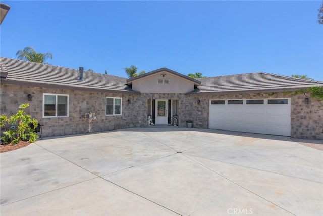 38855 Bella Vista Rd, Temecula, CA 92592 - ranch-style house featuring an attached garage, a tile roof, concrete driveway, and stone siding