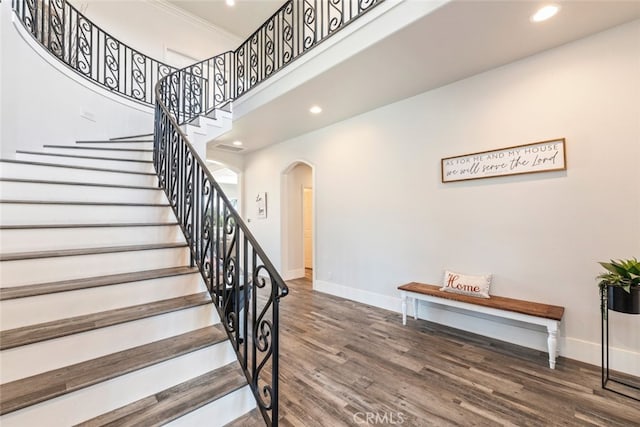 38855 Bella Vista Rd, Temecula, CA 92592 - stairway featuring arched walkways, baseboards, wood finished floors, recessed lighting, and crown molding