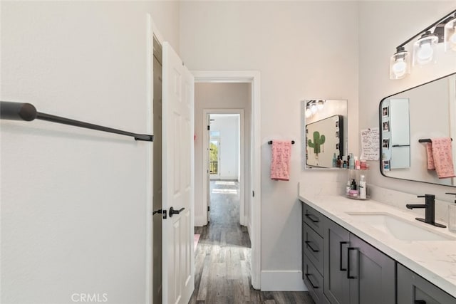 38855 Bella Vista Rd, Temecula, CA 92592 - bathroom with vanity, wood finished floors, and baseboards