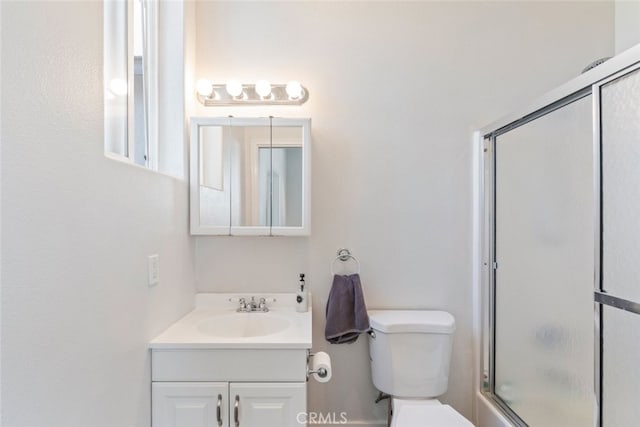 38855 Bella Vista Rd, Temecula, CA 92592 - bathroom featuring vanity, toilet, and bath / shower combo with glass door