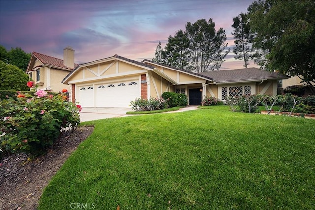 18337 Chatham Ln, Porter Ranch, CA 91326 - view of front facade featuring a garage, a front yard, stucco siding, and concrete driveway