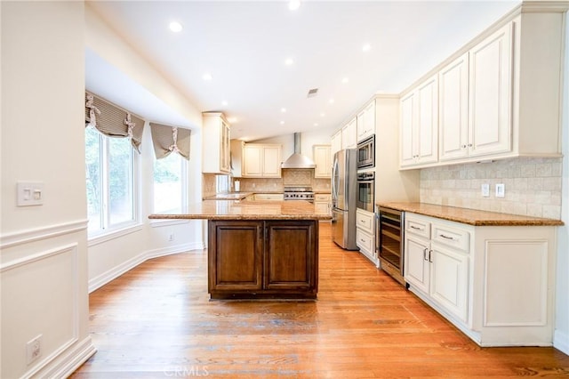 18337 Chatham Ln, Porter Ranch, CA 91326 - kitchen featuring beverage cooler, stainless steel appliances, light stone countertops, backsplash, and light wood-style floors