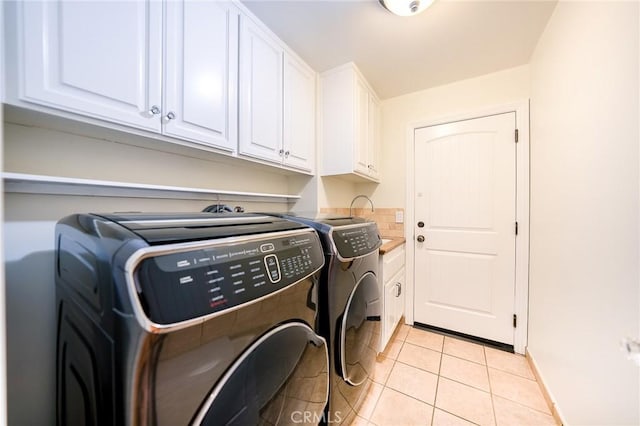 18337 Chatham Ln, Porter Ranch, CA 91326 - laundry area with independent washer and dryer, cabinet space, and light tile patterned floors
