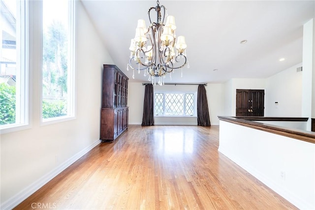 18337 Chatham Ln, Porter Ranch, CA 91326 - unfurnished dining area with a chandelier, light wood-type flooring, and lofted ceiling