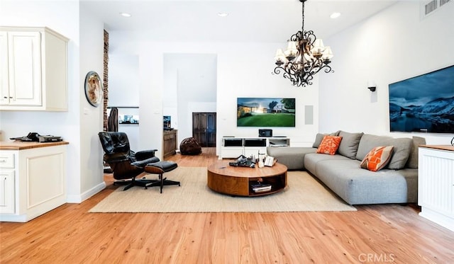 18337 Chatham Ln, Porter Ranch, CA 91326 - living area with light wood finished floors, a chandelier, and recessed lighting