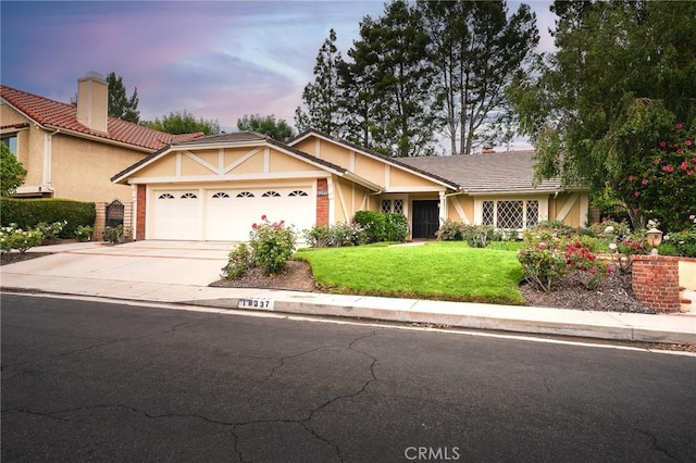 18337 Chatham Ln, Porter Ranch, CA 91326 - ranch-style house with stucco siding, an attached garage, a front yard, and a tiled roof