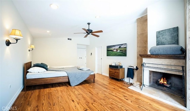 18337 Chatham Ln, Porter Ranch, CA 91326 - bedroom featuring wood finished floors, a large fireplace, and recessed lighting