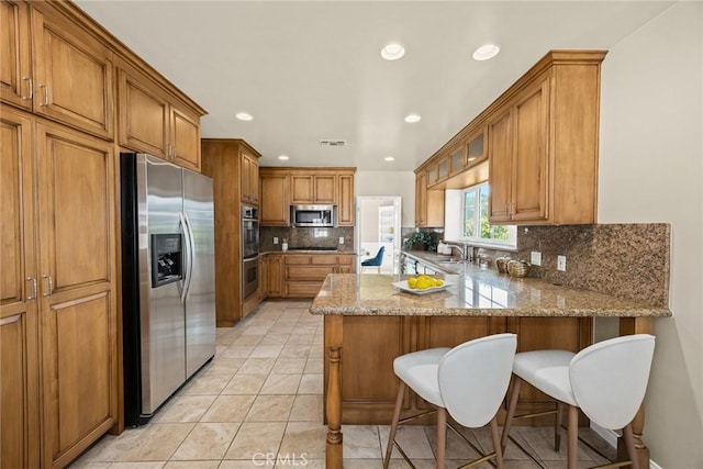 468 Gerona Ave, San Gabriel, CA 91775 - kitchen featuring appliances with stainless steel finishes, a sink, brown cabinets, a peninsula, and recessed lighting