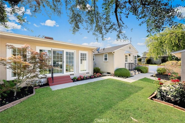 468 Gerona Ave, San Gabriel, CA 91775 - back of property featuring stucco siding, a lawn, and entry steps