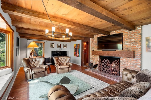 1961 Forester Creek Rd, El Cajon, CA 92021 - living area featuring wooden ceiling with exposed beams, wood finished floors, a chandelier, and a fireplace