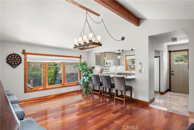 1961 Forester Creek Rd, El Cajon, CA 92021 - dining space with wood finished floors, a chandelier, and baseboards