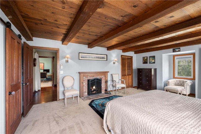 1961 Forester Creek Rd, El Cajon, CA 92021 - bedroom with light colored carpet, wooden ceiling with exposed beams, a brick fireplace, and a barn door