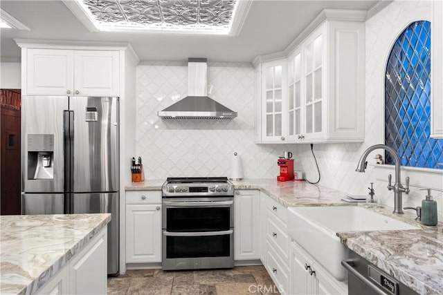 1961 Forester Creek Rd, El Cajon, CA 92021 - kitchen featuring wall chimney range hood, appliances with stainless steel finishes, a sink, backsplash, and white cabinets