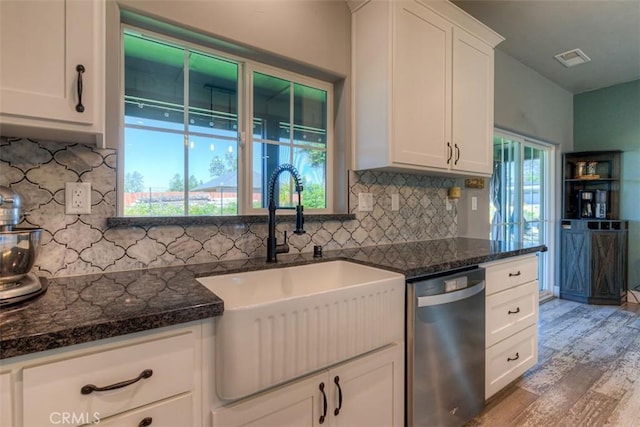 5981 Kibler Rd, Paradise, CA 95969 - kitchen with dishwasher, a sink, wood finished floors, decorative backsplash, and white cabinets