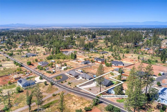 5981 Kibler Rd, Paradise, CA 95969 - aerial overview of property's location with a mountainous background and nearby suburban area