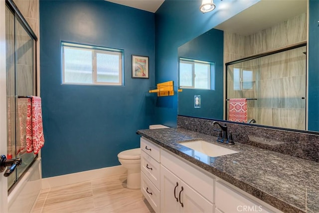 5981 Kibler Rd, Paradise, CA 95969 - full bathroom with baseboards, vanity, toilet, and shower / bath combination with glass door