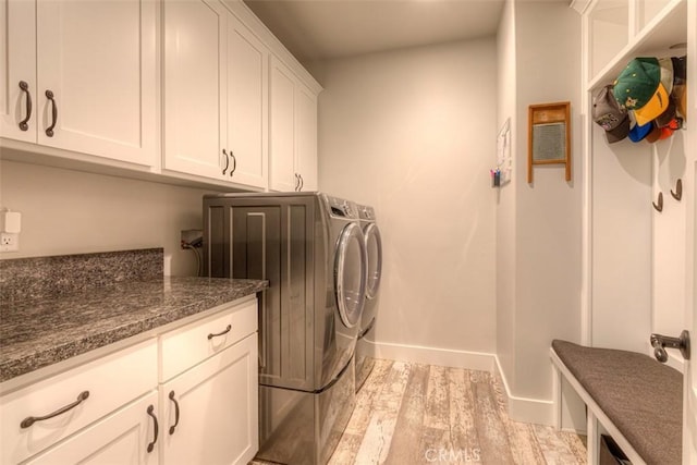 5981 Kibler Rd, Paradise, CA 95969 - washroom featuring independent washer and dryer, cabinet space, light wood-style floors, and baseboards