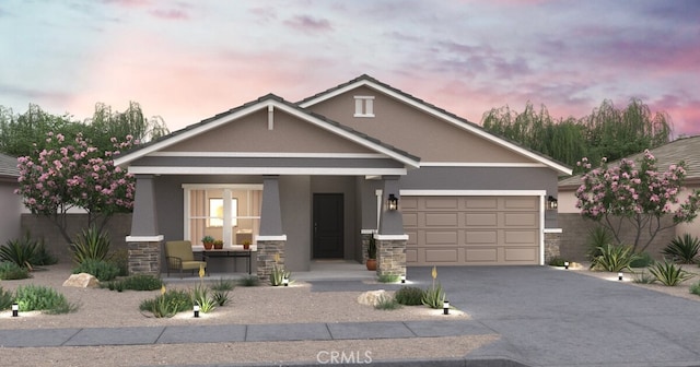 3383 Poplar St, Rosamond, CA 93560 - view of front facade with a porch, stone siding, stucco siding, driveway, and a garage