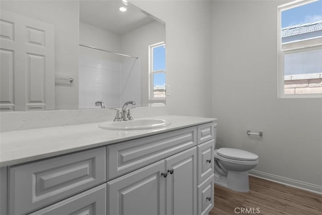 30773 Vera Cruz Cir, Winchester, CA 92596 - full bath with vanity, wood finished floors, healthy amount of natural light, and a shower