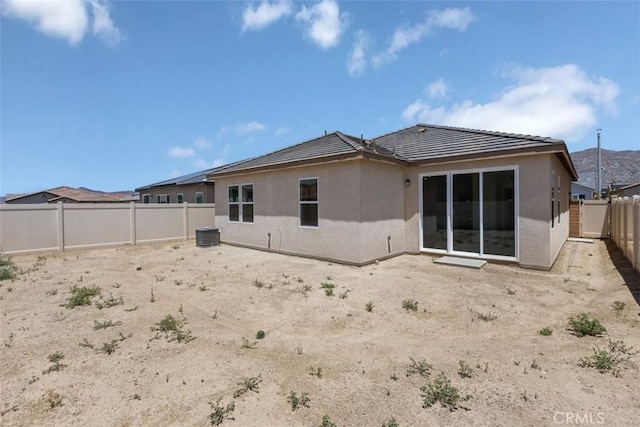30773 Vera Cruz Cir, Winchester, CA 92596 - rear view of house featuring stucco siding, a fenced backyard, and a tiled roof