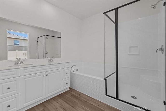 30773 Vera Cruz Cir, Winchester, CA 92596 - full bathroom with a stall shower, a bath, double vanity, and wood finished floors