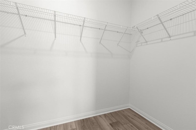 30773 Vera Cruz Cir, Winchester, CA 92596 - walk in closet featuring wood finished floors